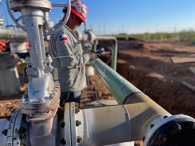 Man taking measurements of a pipeline